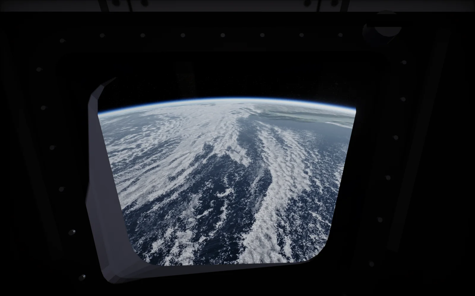 Looking down through a window of the ISS Cupola at clouds over the ocean, with the curve of the Earth near the top