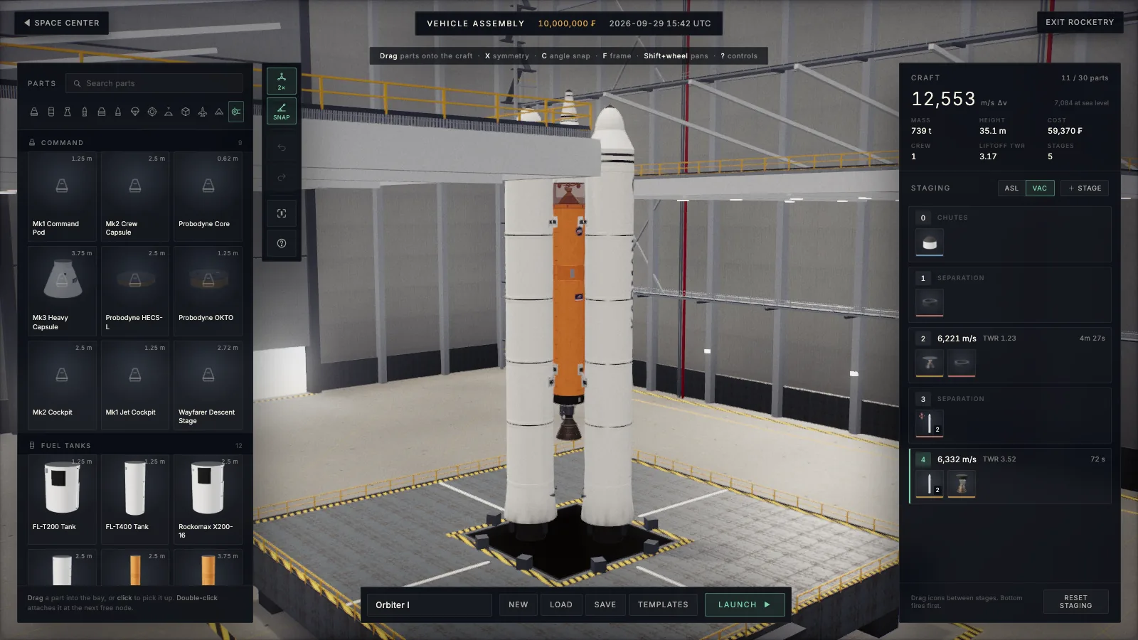 The Vehicle Assembly Building with a two-stage rocket and side boosters on the stand