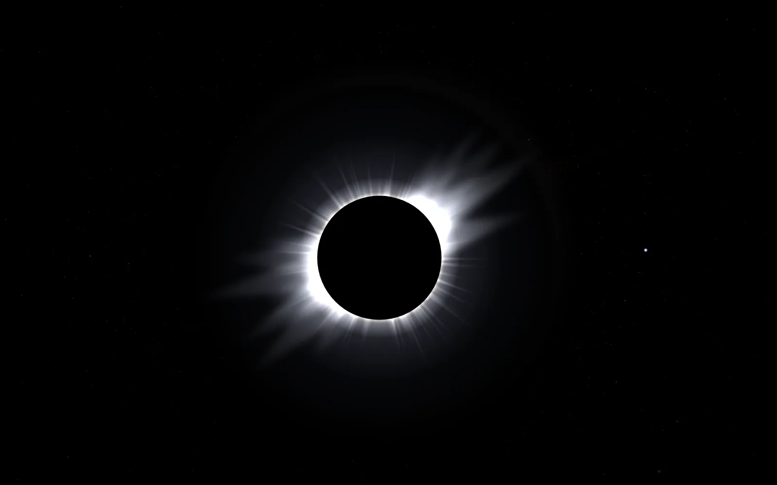 A total solar eclipse: the Moon's black disc ringed by the white streamers of the corona