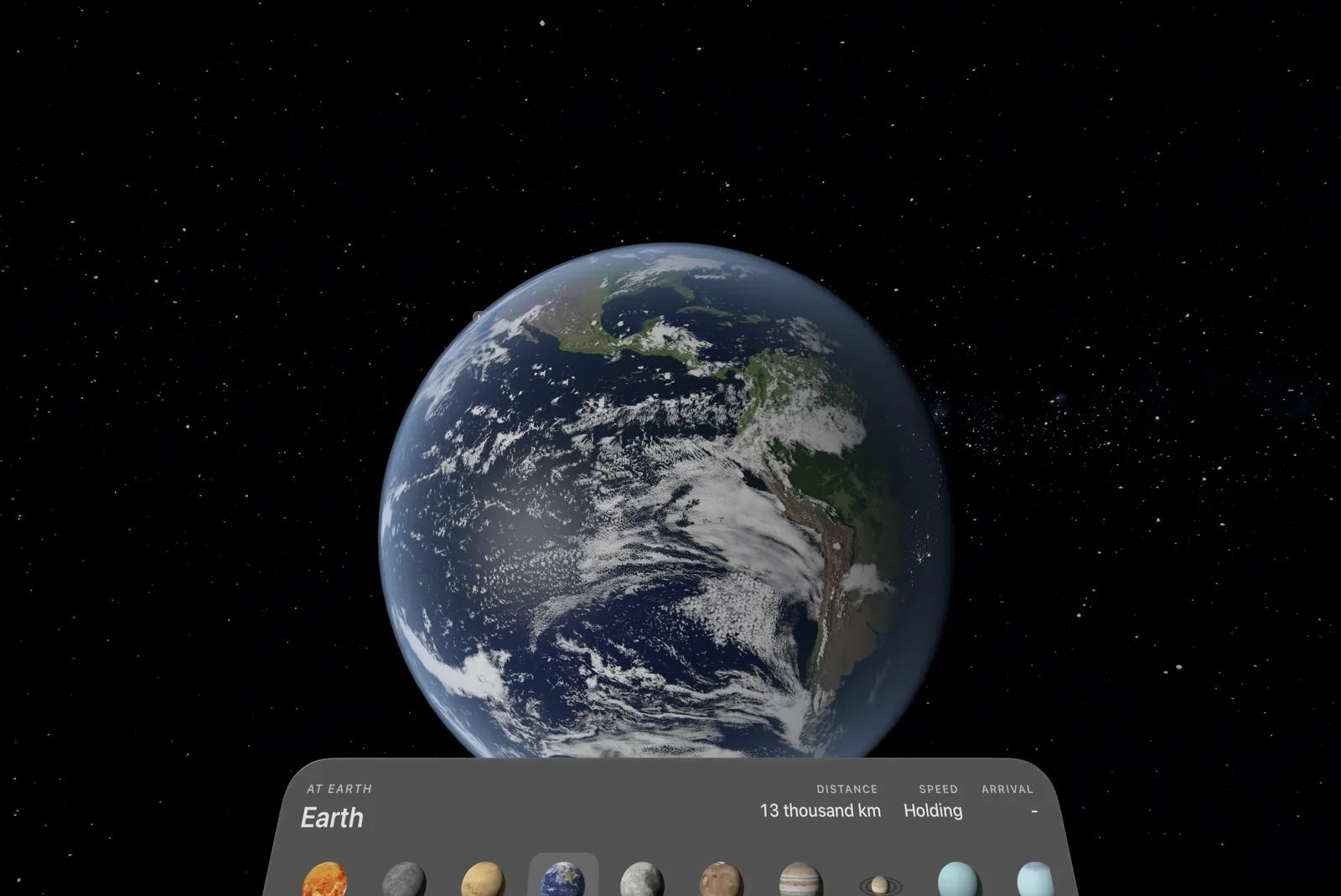 The Earth among the stars in the Vision Pro app, lit as it is today